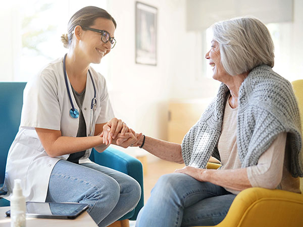 elderly woman meeting with a doctor