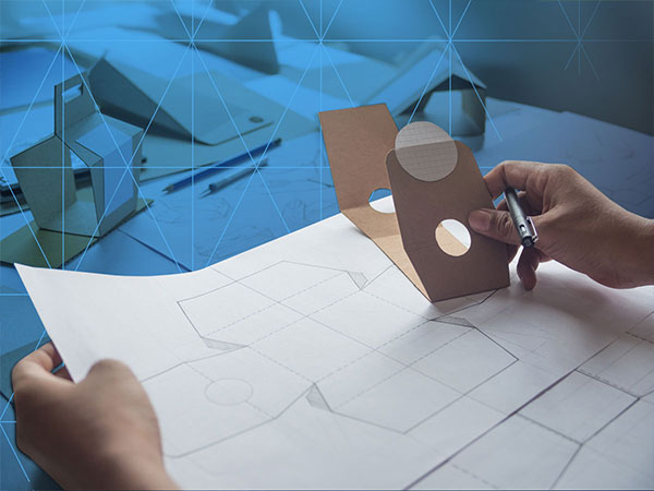 someone sketching packaging designs