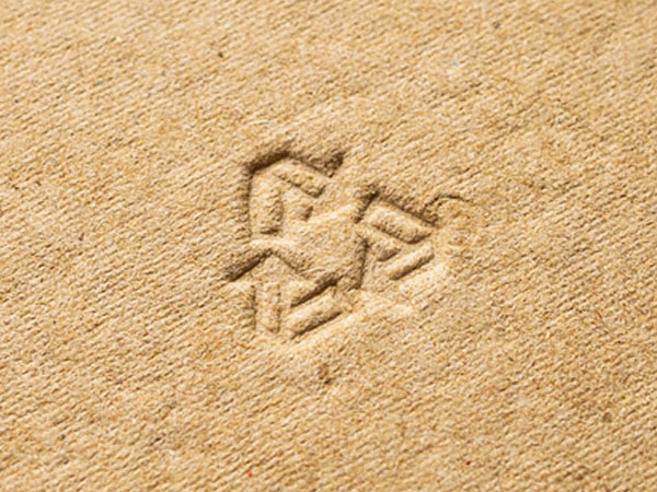 debossed recycle logo on recyclable material
