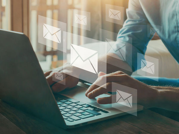 person on laptop checking email