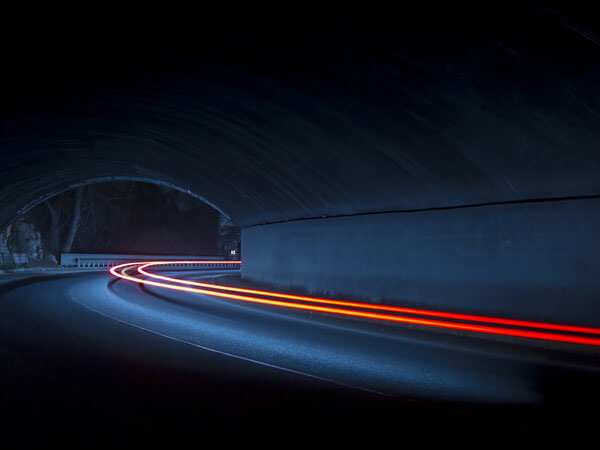 Truck light trails in tunnel