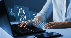 Businesswoman working on laptop with virtual screen.