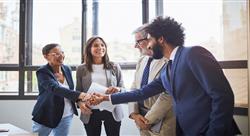A franchise manager talking to two franchise operators